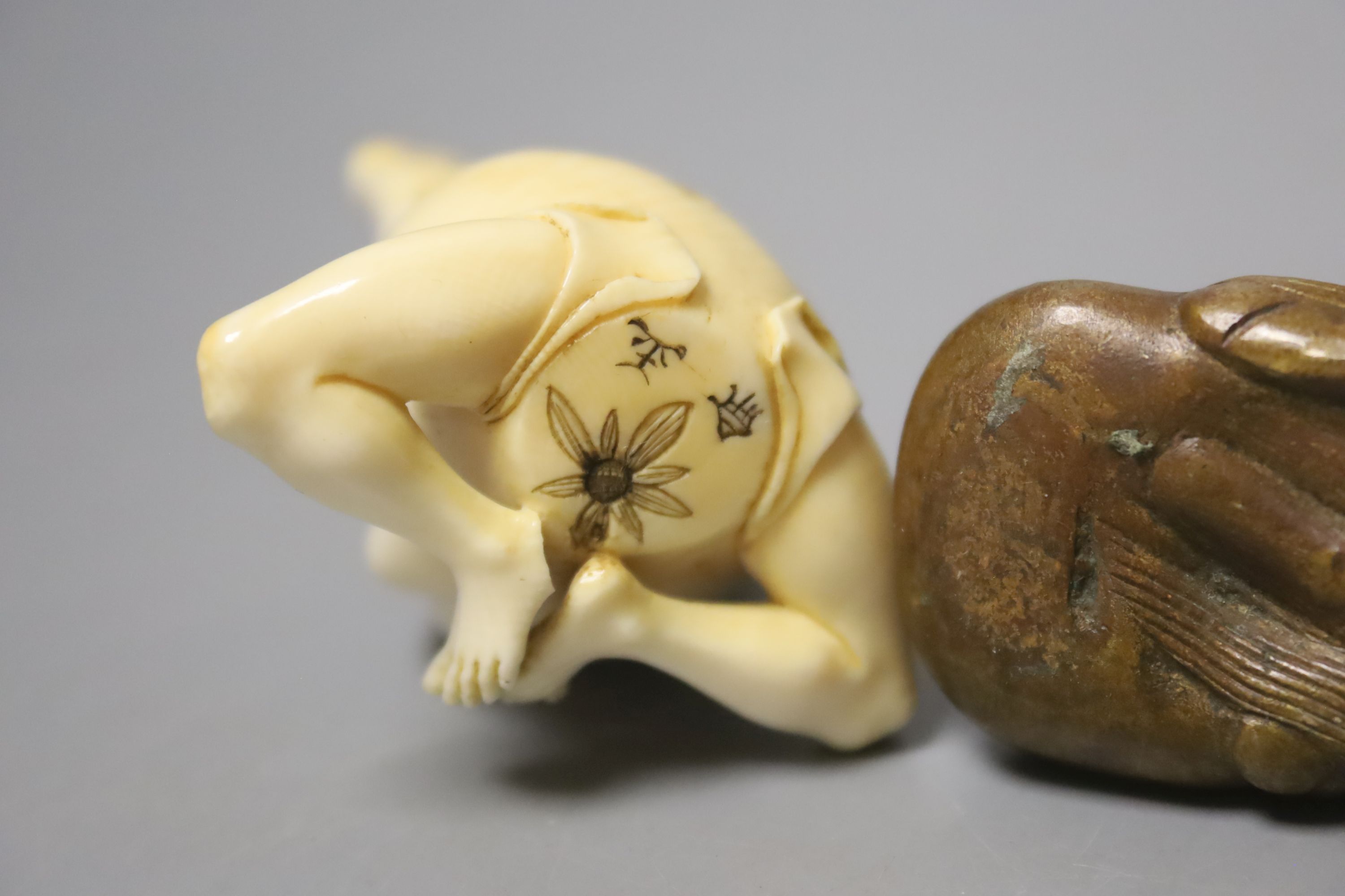 Two ivory carvings and a bronze